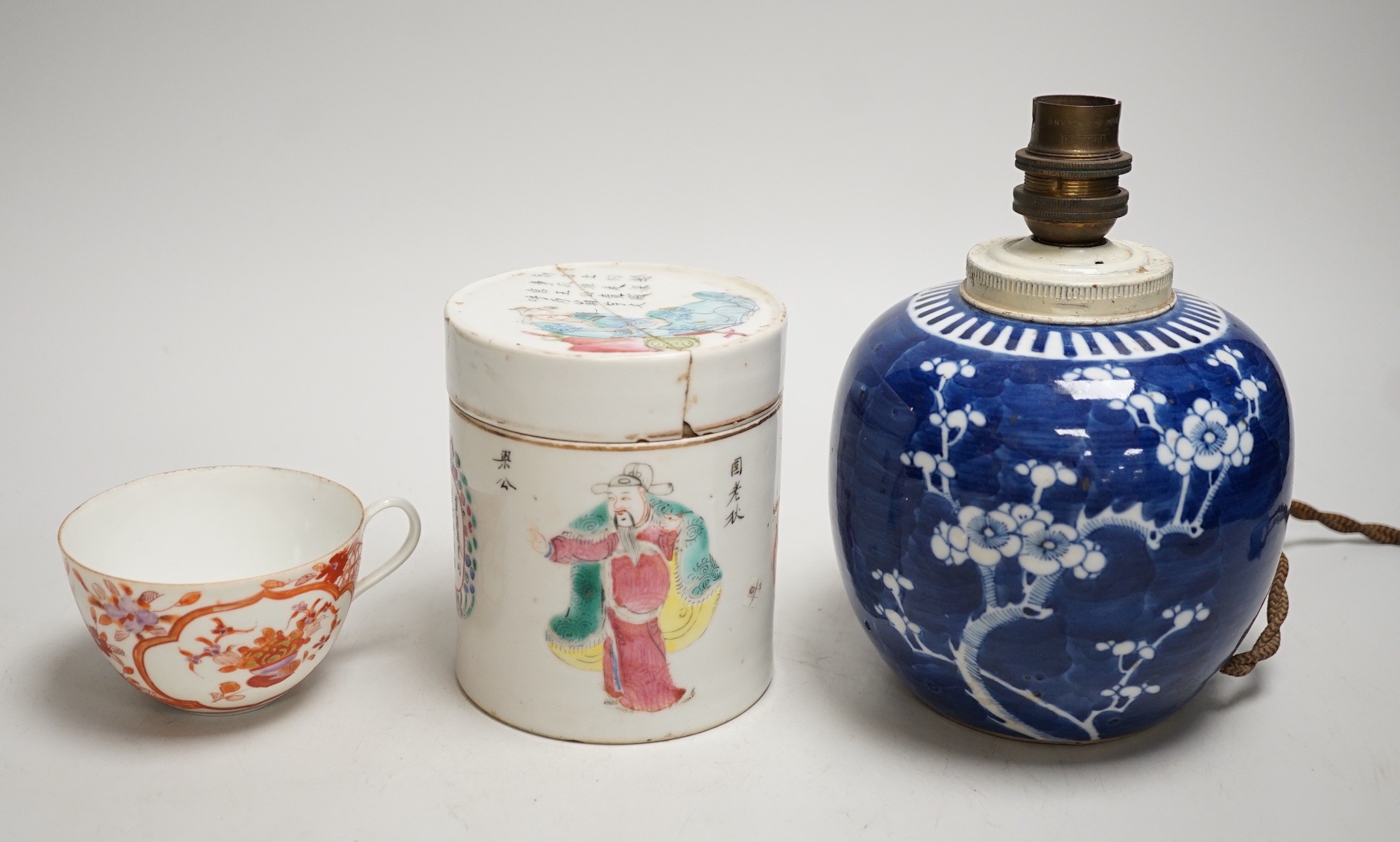 A 19th century Chinese famille rose cylindrical jar and cover, 11.5cm high, a blue and white prunus lamp and a Japanese eggshell porcelain cup